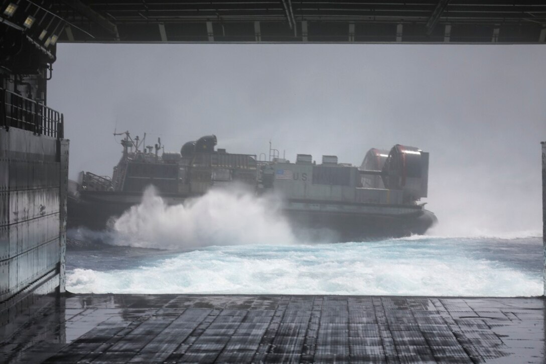 GULF OF ADEN (July 2, 2015) A landing craft, air cushion launches from the well deck of the amphibious transport dock USS Anchorage (LPD 23).  The Anchorage is part of the Essex Amphibious Ready Group and, with the embarked 15th Marine Expeditionary Unit, is deployed in support of maritime security operations and theater security cooperation efforts in the U.S. 5th Fleet area of operations. (U.S. Marine Corps photo by Sgt. Jamean Berry/Released)