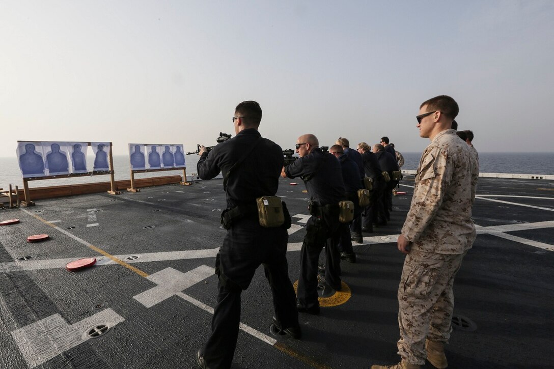 GULF OF ADEN (July 2, 2015) U.S. Marines with the 15th Marine Expeditionary Unit’s Maritime Raid Force assist the visit, board, search, and seizure team aboard the amphibious transport dock USS Anchorage (LPD 23) with range operations.  The Anchorage is part of the Essex Amphibious Ready Group and, with the embarked 15th Marine Expeditionary Unit, is deployed in support of maritime security operations and theater security cooperation efforts in the U.S. 5th Fleet area of operations. (U.S. Marine Corps photo by Sgt. Jamean Berry/Released)
