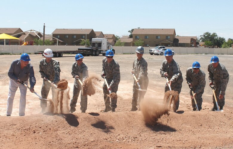 HOLLOMAN AIR FORCE BASE, N.M. – District Commander Lt. Col. Patrick Dagon (second from left) joins Lt. Col. Kathleen Mackey, commander of the 49th Medical Support Squadron (third from left); and Col. Leslie Knight, commander of the 49th Medical Group (fifth from left) to break ground on the new medical clinic at the base, July 1, 2015.