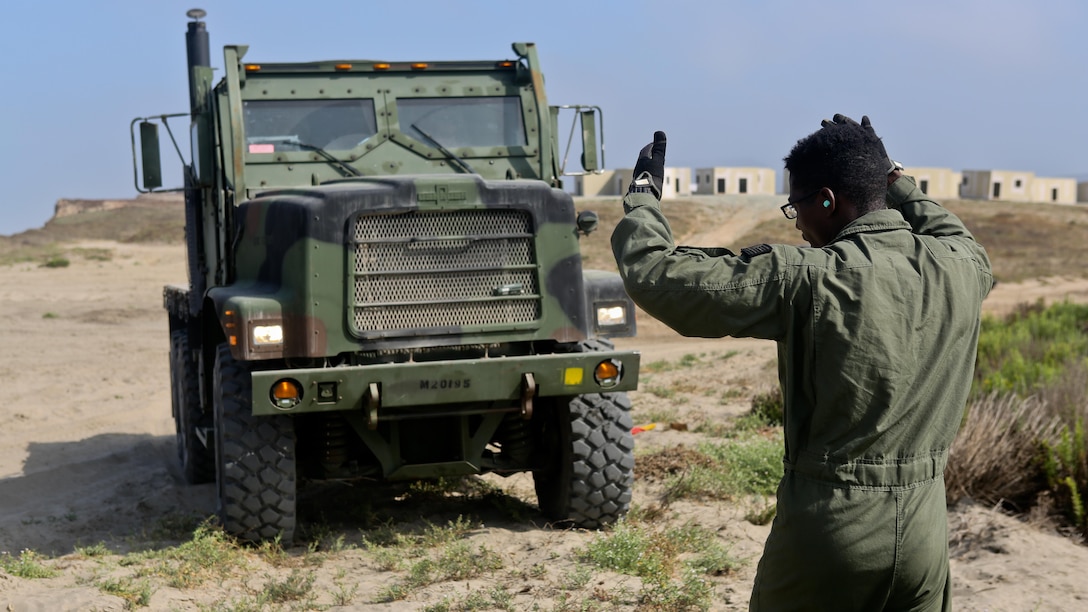 U.S. Marine Medium Tactical Vehicle Replacement is loaded onto U.S. Navy Landing Craft Air Cushioned (LCAC) vehicle from Assault Craft Unit 5 on Red Beach as part of a loading exercise along side Combat Logistics Battalion 11, Headquarters Regiment, 1st Marine Logistics Group at Marine Corps Base Camp Pendleton, California, June 23, 2015. This loading exercise reinforces the Marine Corps role as an amphibious force in readiness by maintaining capabilities through realistic training.