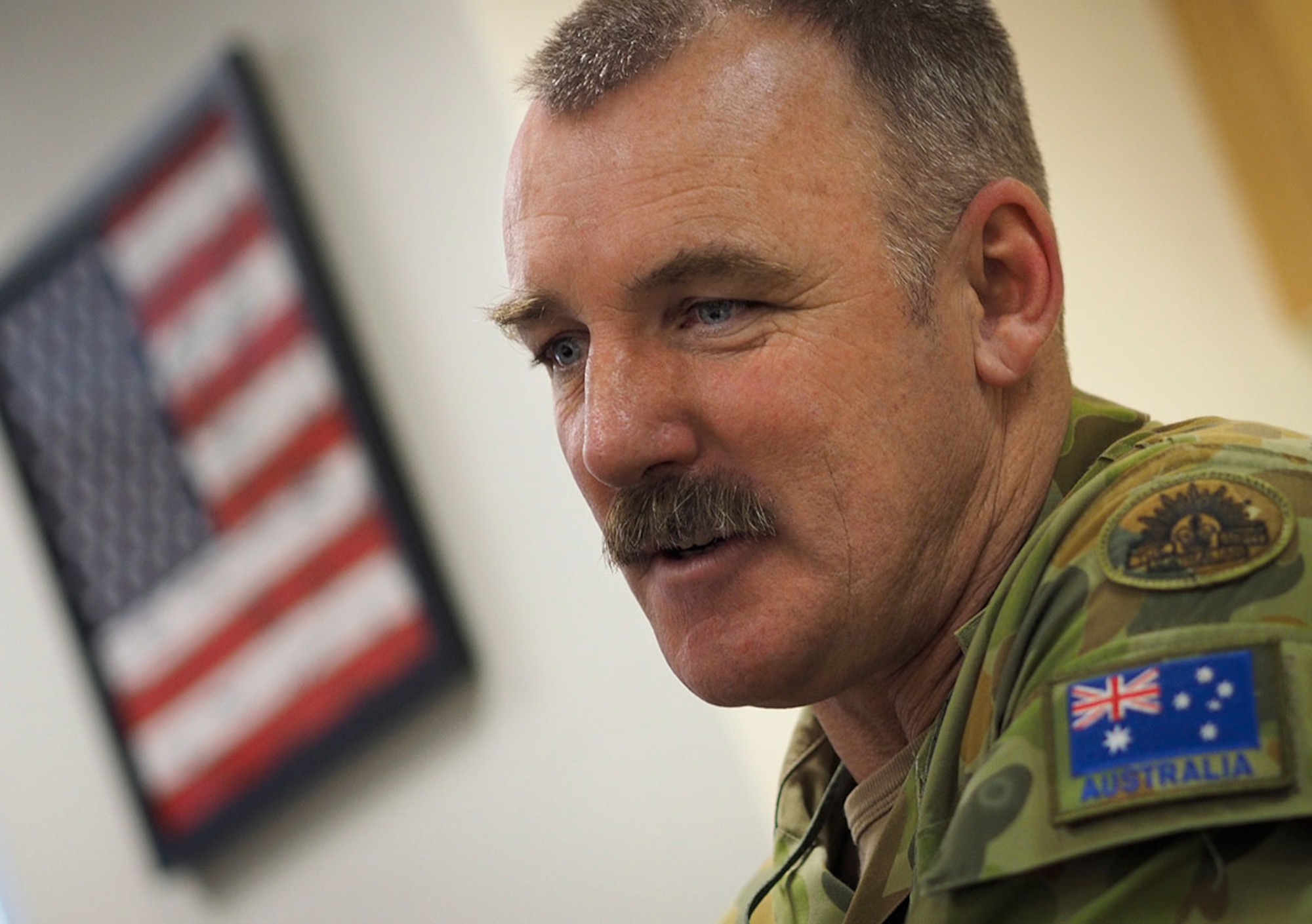 Australian Army Warrant Officer Class 2 Roderick Orchard talks about joint training operations with American paratroopers assigned to the 4th Infantry Brigade Combat Team (Airborne), 25th Infantry Division, U.S. Army Alaska, on Joint Base Elmendorf-Richardson, Alaska, July 1, 2015. (U.S. Air Force photo by Justin Connaher/Released)
