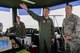 Lt. Gen. John Dolan, United States Forces, Japan and the 5th Air Force commander, learns about Yokota operations from Col. Douglas DeLaMater, 374th Airlift Wing commander, at the installation air traffic control tower on Yokota Air Base, Japan, July 7, 2015. Dolan traveled to several buildings on Yokota to speak with Airmen and receive briefings from subject matter experts as part of his Wing immersion tour. (U.S. Air Force photo by Airman 1st Class Elizabeth Baker/Released)