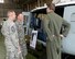 Lt. Gen. John Dolan, United States Forces, Japan and the 5th Air Force commander, and Chief Master Sgt. James Laurent, USFJ and 5th AF command chief, receive a briefing on the UH-1N Iroquois at Yokota Air Base, Japan, July 7, 2015. Dolan traveled to several buildings on Yokota to speak with Airmen and receive briefings from subject matter experts as part of his Wing immersion tour. (U.S. Air Force photo by Airman 1st Class Elizabeth Baker/Released)