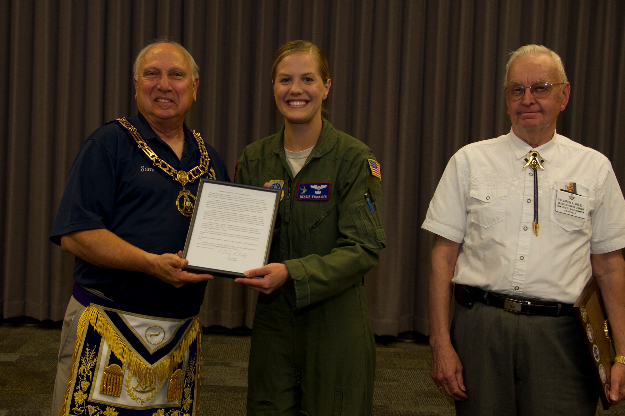 1st Lt. Meagan Wyngarden, 93rd Air Refueling Squadron KC-135 Stratotanker pilot, poses with members of the Masonic Lodges of Washington, July 8, 2015, at Fairchild Air Force Base, Wash. Wyngarden was honored as the Air Force Representative of the Year by the Masonic Lodges of Washington. (U.S. Air Force photo/Airman 1st Class Nicolo J. Daniello)