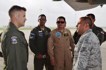 Staff Sgt. Chris Lewis (left), a C-5A Galaxy flight engineer from the 68th Airlift Squadron, talks with Tech. Sgt. Sergio Estrada (right) an instructor at the Inter-American Air Forces Academy during a tour of the C-5A Galaxy aircraft at Joint Base San Antonio-Lackland, Texas, July 8, 2015. Since 1942, IAAFA has conducted international training in the Spanish language, forging ties with Latin American military, national police and governmental agencies.  (U.S. Air Force photo/Tech Sgt. Carlos J. Trevino)