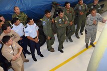 Master Sgt. Carlos Medrano Jr.(right), aircraft engine supervisor with the 433rd Maintenance Squadron, explains the repair process of the engines on the C-5A Galaxy aircraft to students from Inter-American Air Forces Academy at Joint Base San Antonio-Lackland, Texas, July 8, 2015. Since 1942, IAAFA has conducted international training in the Spanish language, forging ties with Latin American military, national police and governmental agencies. (U.S. Air Force photo/Tech Sgt. Carlos J. Trevino)