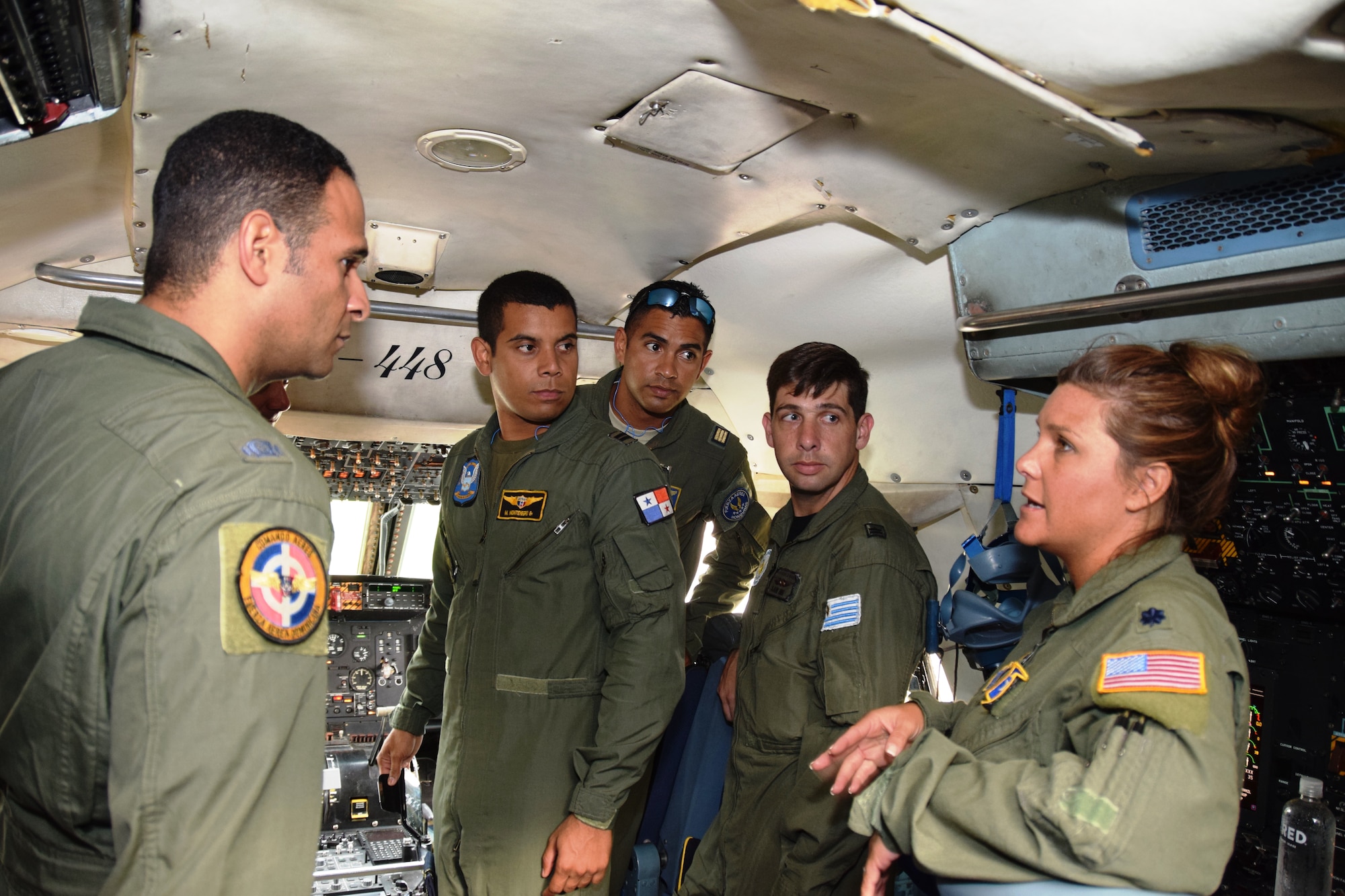 Lt. Col. Kari L. Hill, a pilot with the 68th Airlift Squadron, talks with students from Inter-American Air Forces Academy at Joint Base San Antonio-Lackland, Texas, and July 8, 2015. Hill talked about the training and the qualifications necessary to fly the C-5A Galaxy. The Academy continues to remove language and cultural barriers by building partnerships between the United States and countries in the North and South American continents, Central America and the Caribbean region.  (U.S. Air Force photo/Tech Sgt. Carlos J. Trevino)
