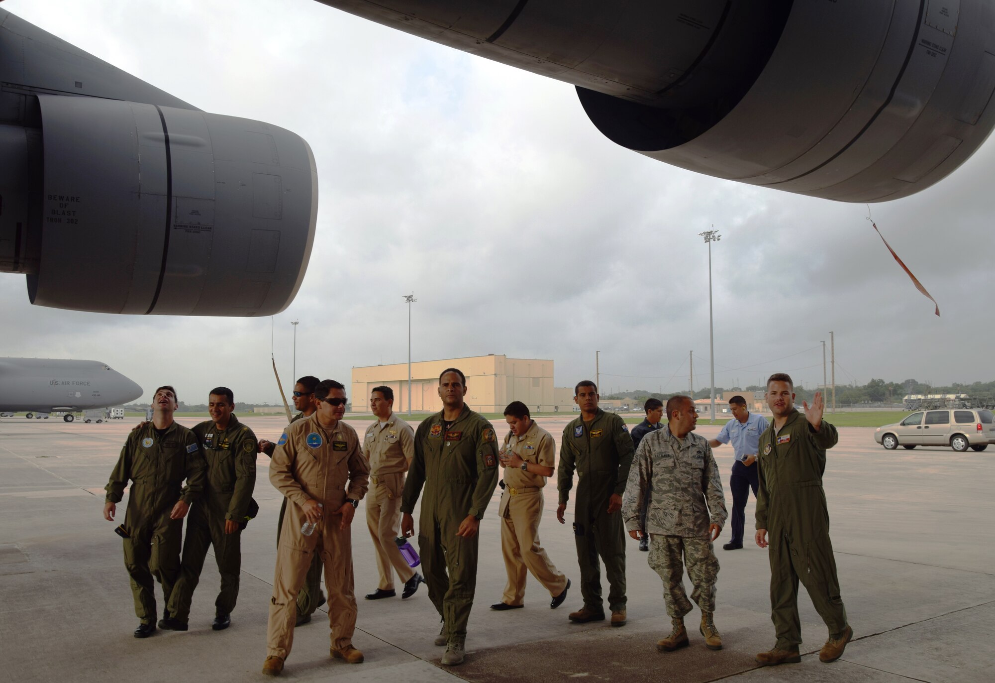 Staff Sgt. Chris Lewis, a C-5A Galaxy flight engineer from the 68th Airlift Squadron, leads a group of students from the Inter-American Air Forces Academy during a tour of the C-5A Galaxy aircraft at Joint Base San Antonio-Lackland on July 8, 2015. Since 1942, IAAFA has conducted international training in the Spanish language, forging ties with Latin American military, national police and governmental agencies.  (U.S. Air Force photo/Tech Sgt. Carlos J. Trevino)