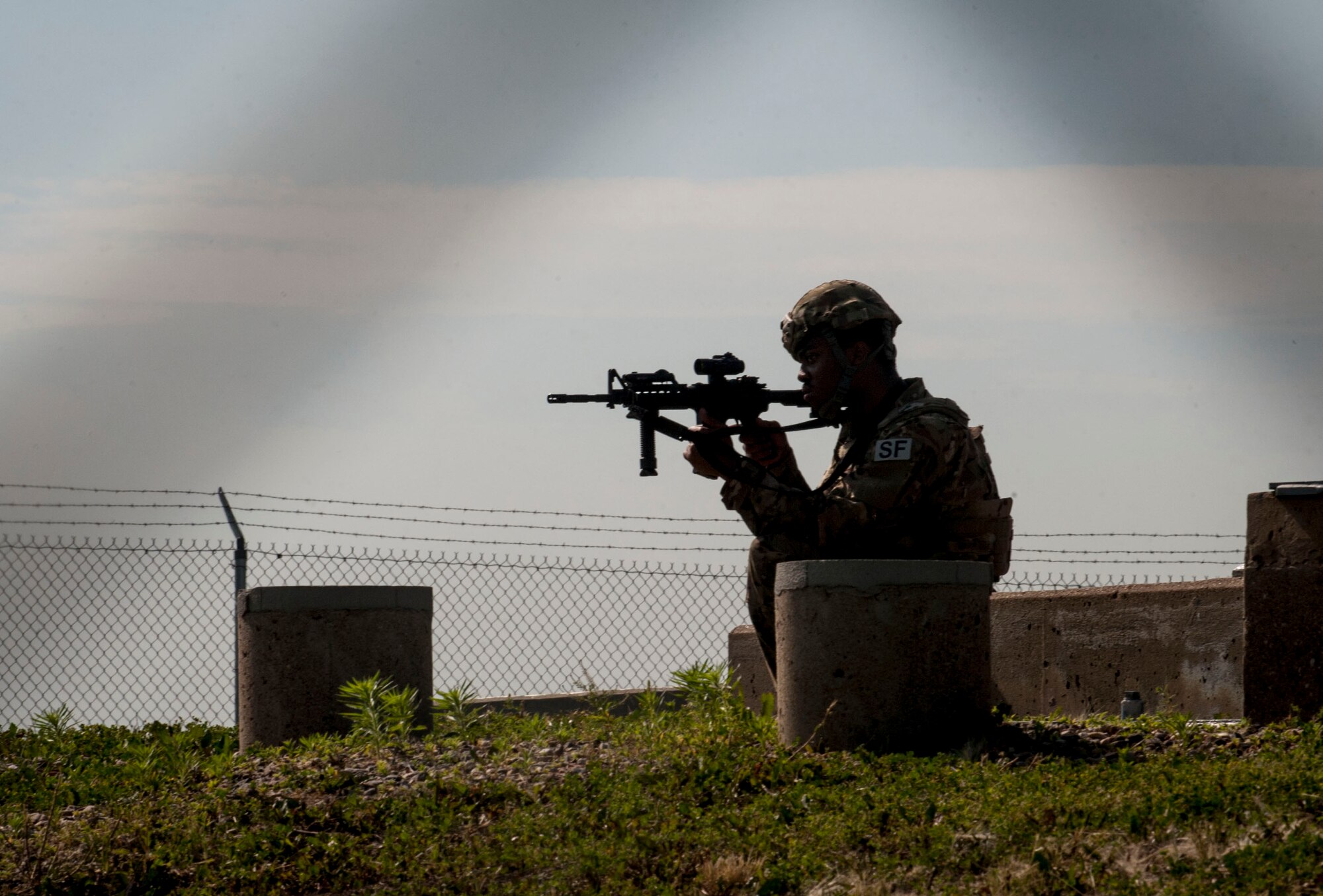 A 91st Missile Wing Security Forces Group member stands guard during an exercise near Donnybrook, N.D., June 29, 2015. During the exercise, the Airmen from the 91st MW Missile Security Forces Squadron, 219th SFS and 791st MSFS worked together to apprehend personnel dressed as simulated aggressors and re-capture a launch facility.  (U.S. Air Force photo/Senior Airman Stephanie Morris)
