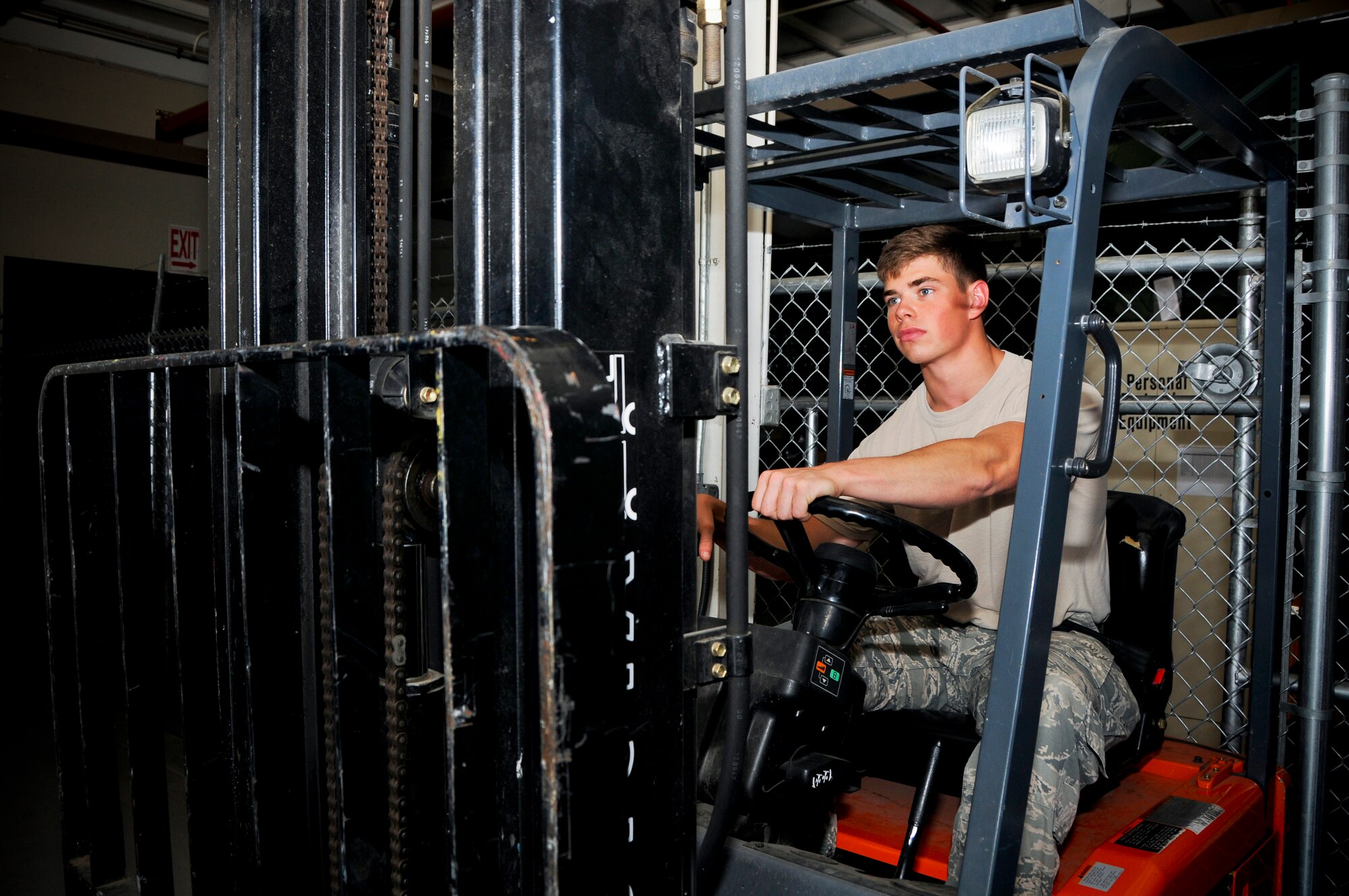 Airman 1st Class Parker Dunn, 188th Logistics Readiness Squadron vehicle operator, maneuvers a forklift to move packages June 4, 2015, at Ebbing Air National Guard Base, Fort Smith, Ark. Dunn’s exceptional work ethic has brought him high esteem among his fellow Airmen and earned him the July 2015 The Flying Razorback spotlight. (U.S. Air National Guard photo by Senior Airman Cody Martin/Released)