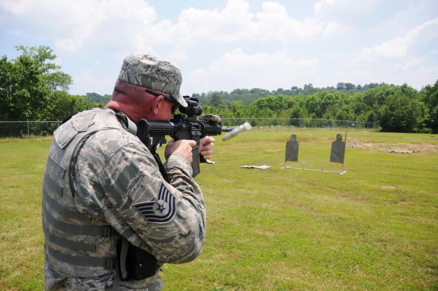 Tech. Sgt. Quincy Cherry, 188th Security Forces Squadron operations specialist, zeros in on his target June 9, 2015, while practicing marksmanship skills at Ebbing Air National Guard Base, Fort Smith, Ark. This weapon sustainment training is an annual requirement for Security Forces members aimed at increasing weapon deployment abilities of the team and individual. (U.S. Air National Guard photo by Senior Airman Cody Martin/Released)