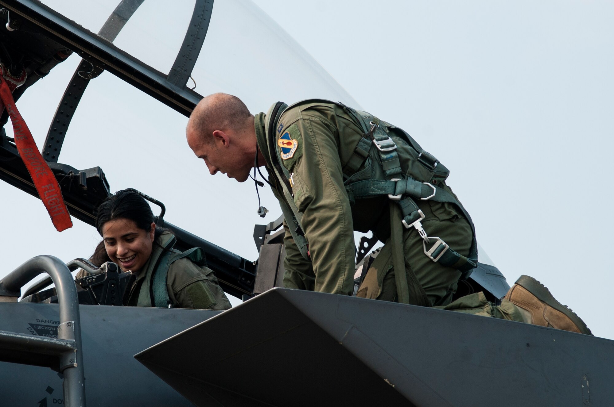 Capt. Michael Fitzsimmons (right), 334th Fighter Squadron pilot, shows Sarah Napierja, wife of Staff Sgt. Michael Napierja, 4th Aircraft Maintenance Squadron crew chief, the inside of an F-15E Strike Eagle cockpit during a spouse orientation, July 1, 2015, at Seymour Johnson Air Force Base, North Carolina. During the orientation, spouses from the 4th Maintenance Group and 4th Operations Group were given an opportunity to familiarize themselves with the F-15E Strike Eagle, both inside and out. (U.S. Air Force photo/Airman Shawna L. Keyes)