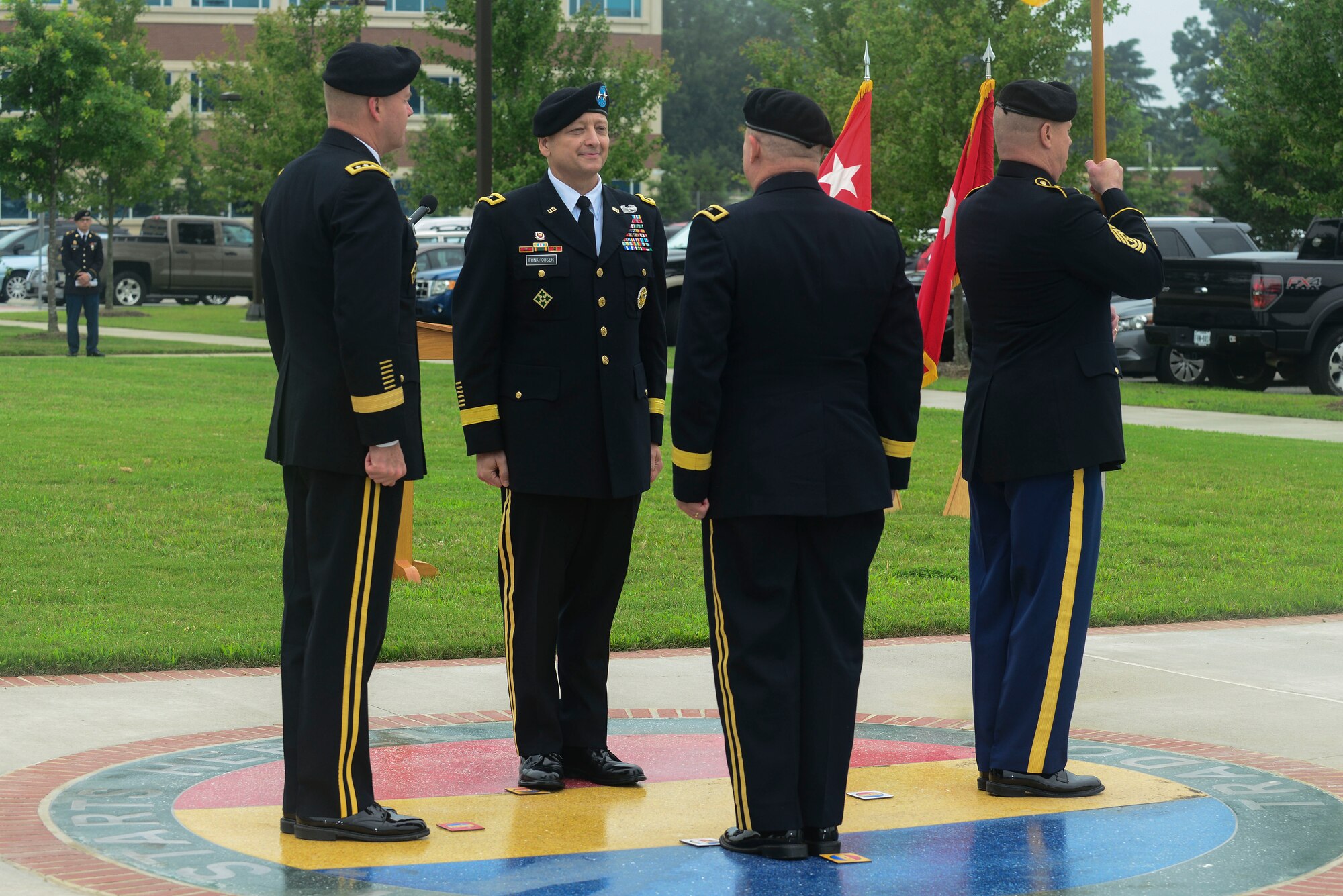 U.S. Army Soldiers from the Center for Initial Military Training and U.S. Army Training and Doctrine Command take part in a change of command ceremony at Fort Eustis, Va., July 2, 2015. Maj. Gen. Anthony Funkhouser, Center for Initial Military Training commander, took command from Maj. Gen. Ross Ridge, CIMT former commander during the ceremony. (U.S. Air Force photo by Senior Airman Kimberly Nagle/Released)