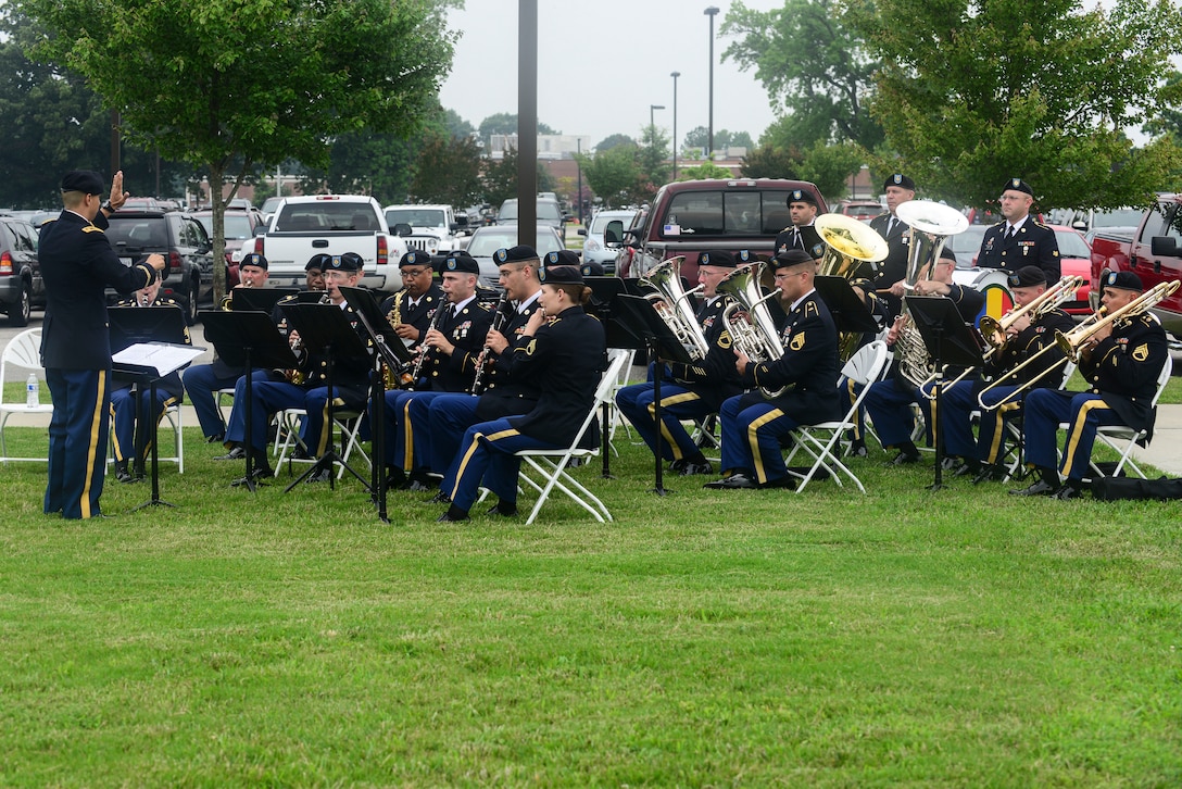 U.S. Army Soldiers from the U.S. Army Training and Doctrine Command Band perform for the Center for Initial Military Training change of command and retirement ceremony at Fort Eustis, Va., July 2, 2015. The band provided music during the ceremony and concluded with the playing of the Army Song as Maj. Gen. Ross E. Ridge, CIMT outgoing commander, relinquished command to Maj. Gen. Anthony Funkhouser, CIMT commander. (U.S. Air Force photo by Senior Airman Kimberly Nagle/Released)