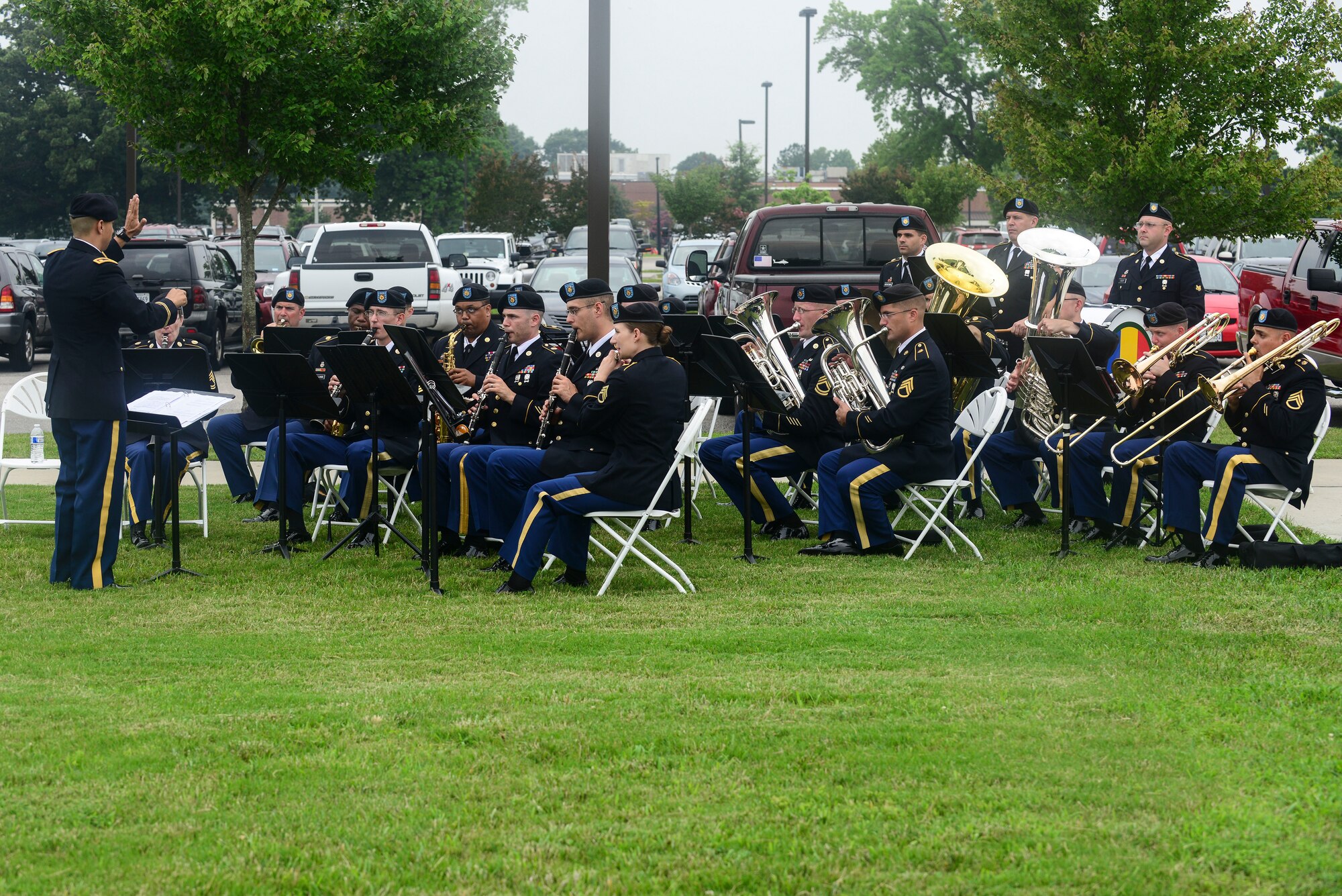 U.S. Army Soldiers from the U.S. Army Training and Doctrine Command Band perform for the Center for Initial Military Training change of command and retirement ceremony at Fort Eustis, Va., July 2, 2015. The band provided music during the ceremony and concluded with the playing of the Army Song as Maj. Gen. Ross E. Ridge, CIMT outgoing commander, relinquished command to Maj. Gen. Anthony Funkhouser, CIMT commander. (U.S. Air Force photo by Senior Airman Kimberly Nagle/Released)