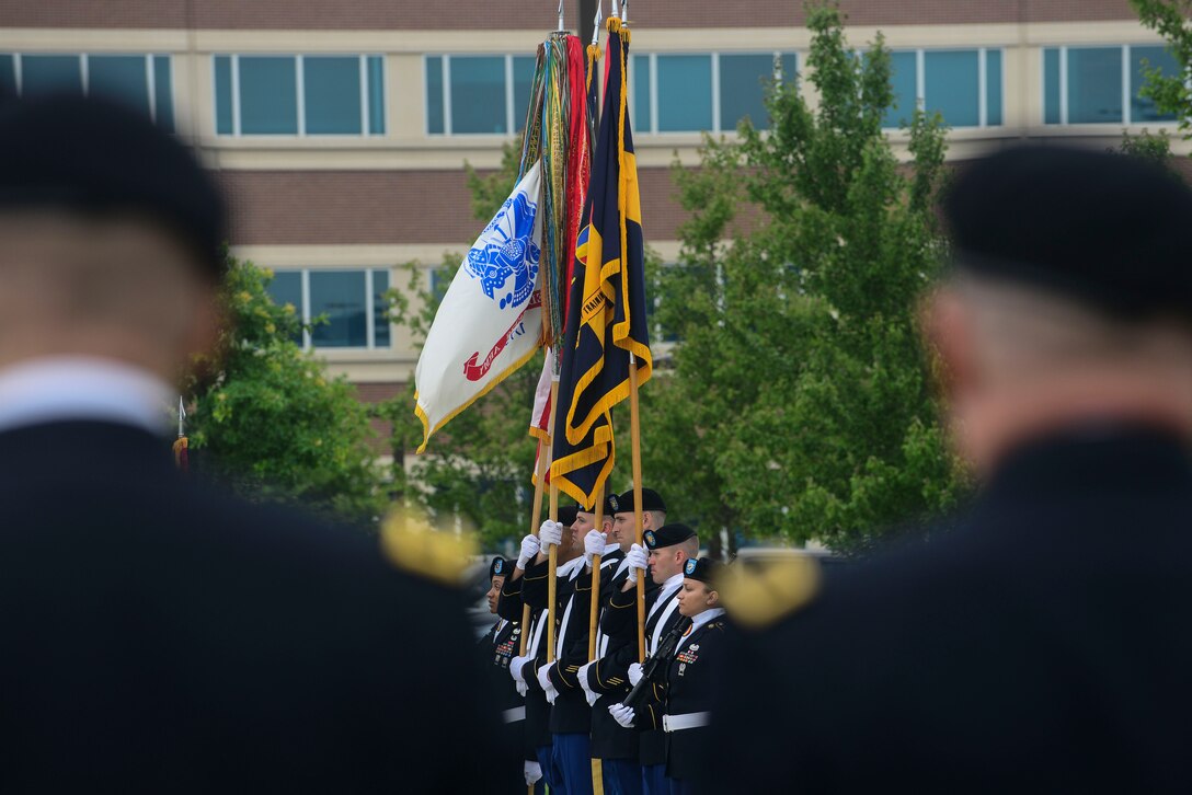 U.S. Army Soldiers present the colors at the Center for Initial Military Training change of command and retirement ceremony at Fort Eustis, Va., July 2, 2015. During the ceremony Maj. Gen. Ross E. Ridge, CIMT outgoing commander, relinquished command to Maj. Gen. Anthony Funkhouser, CIMT commander. Ridge was with CIMT for two of his 35 years of service. (U.S. Air Force photo by Senior Airman Kimberly Nagle/Released)