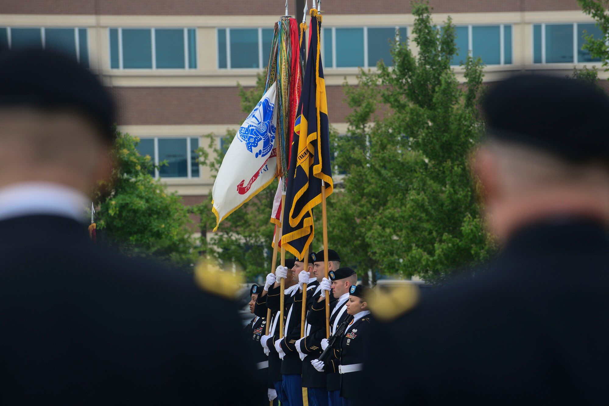 U.S. Army Soldiers present the colors at the Center for Initial Military Training change of command and retirement ceremony at Fort Eustis, Va., July 2, 2015. During the ceremony Maj. Gen. Ross E. Ridge, CIMT outgoing commander, relinquished command to Maj. Gen. Anthony Funkhouser, CIMT commander. Ridge was with CIMT for two of his 35 years of service. (U.S. Air Force photo by Senior Airman Kimberly Nagle/Released)