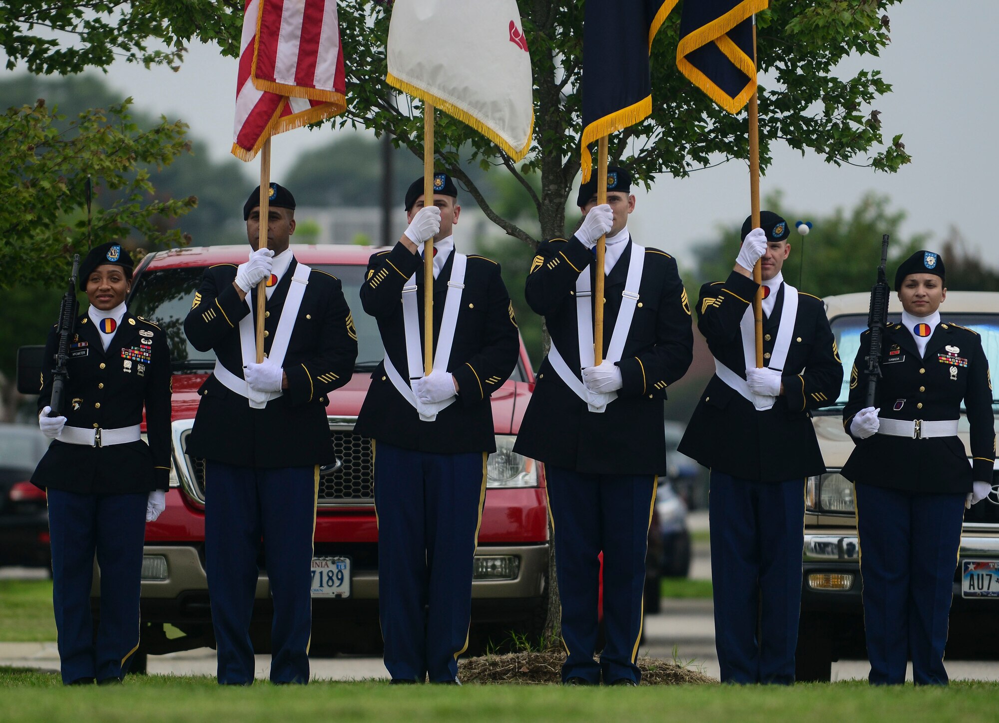 U.S. Army Soldiers prepare to present the colors at the Center for Initial Military Training change of command and retirement ceremony at Fort Eustis, Va., July 2, 2015. The color guard was there to honor Maj. Gen. Ross E. Ridge, the CIMT outgoing commander, as he relinquishes command and retires after 35 years of service. (U.S. Air Force photo by Senior Airman Kimberly Nagle/Released)