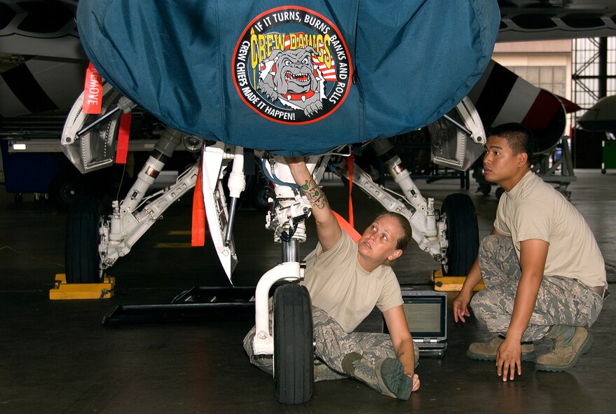 Airman 1st Class Jessica Sutherland and Airman Bryan Depuno, 362nd Training Squadron Aerospace Maintenance Course students, perform preflight and post flight maintenance inspection on a Thunderbird F-16 Fighting Falcon trainer July 7, 2015 at Sheppard Air Force Base, Texas. Students train to inspect for faults and damages and make necessary repairs before the aircraft is ready to fly. (U.S. Air Force Photo Danny Webb)