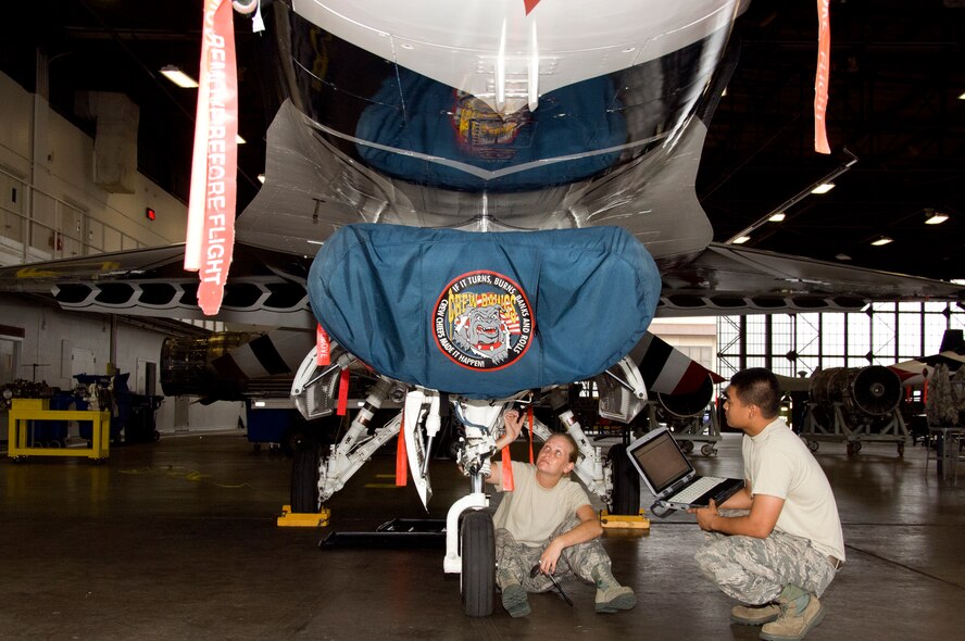 Airman 1st Class Jessica Sutherland and Airman Bryan Depuno, 362nd Training Squadron Aerospace Maintenance Course students, perform preflight and post flight maintenance inspection on a Thunderbird F-16 Fighting Falcon trainer July 7, 2015 at Sheppard Air Force Base, Texas. Students train to inspect for faults and damages and make necessary repairs before the aircraft is ready to fly. (U.S. Air Force Photo Danny Webb)