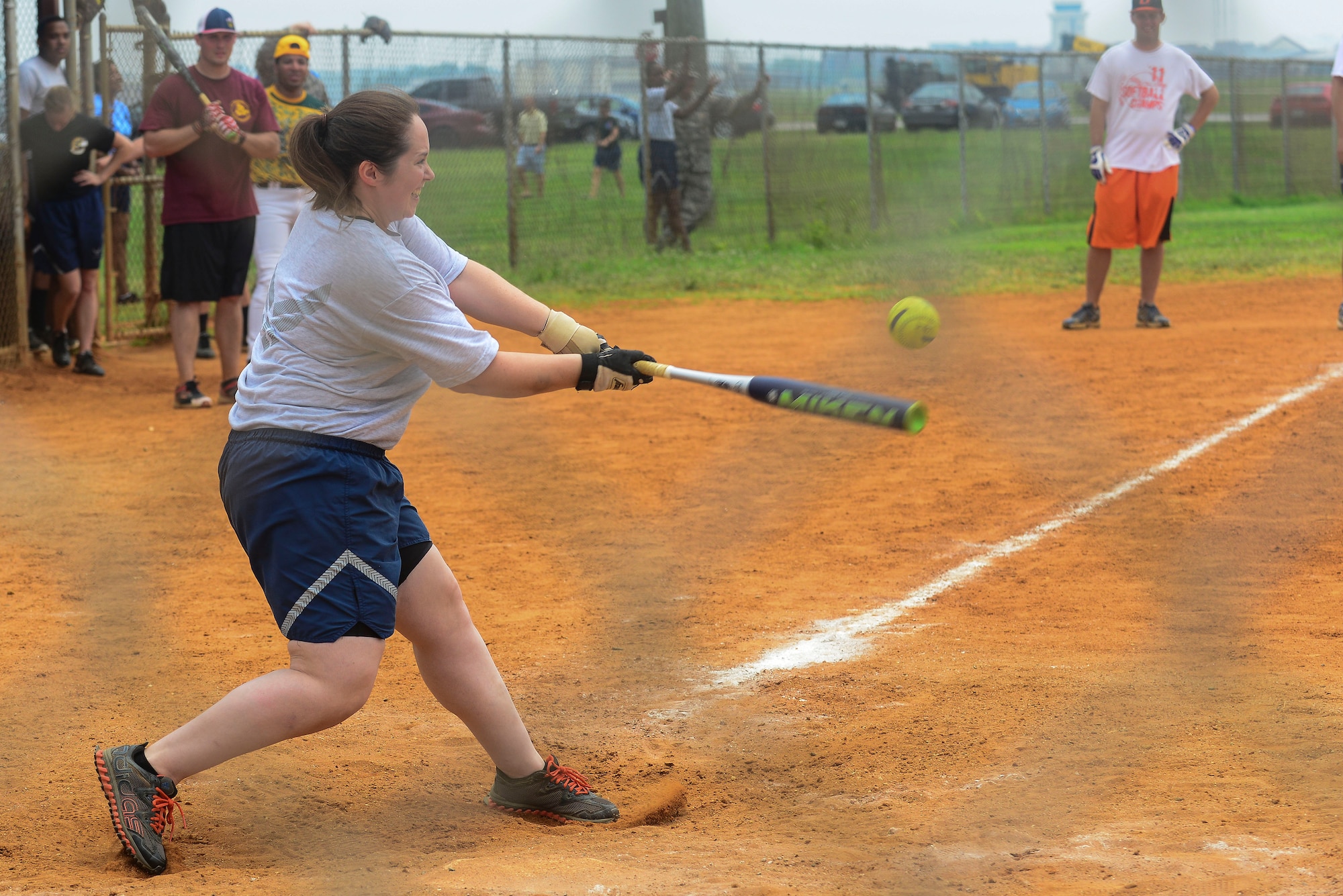 U.S. Air Force Senior Airman Rosemary Williams, 633rd Logistics Readiness Squadron logistics planner, hits a softball during a Warrior Day at Langley Air Force Base, Va., July 2, 2015. Williams played on the Airmen team during the “eagles and chiefs verses Airmen” softball game. (U.S. Air Force photo by Senior Airman Kimberly Nagle/Released)