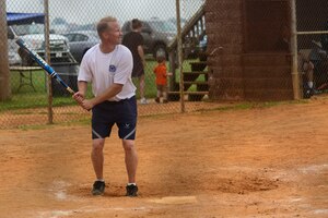 U.S. Air Force Chief Master Sgt. Mark Hurst, 633rd Air Base Wing command chief, participates in a softball game during a base-wide Warrior Day at Langley Air Force Base, Va., July 2, 2015.  Hurst took part in the “eagles and chiefs verses Airmen” softball game, one of many events held throughout the day.  (U.S. Air Force photo by Senior Airman Kimberly Nagle/Released)
