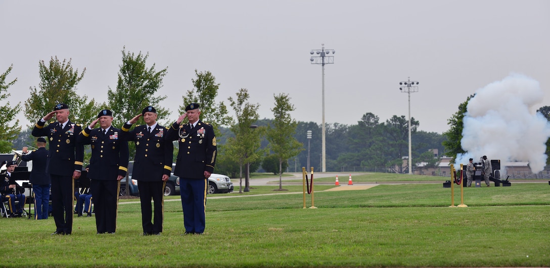 U.S. Army Training and Doctrine Command leaders salute during the Center for Initial Military Training change of command at Fort Eustis, Va., July 2, 2015. The outgoing commander, Maj. Gen. Ross E. Ridge, also celebrated his retirement in conjunction with the ceremony. (U.S. Air Force photo by Staff Sgt. Natasha Stannard/released)