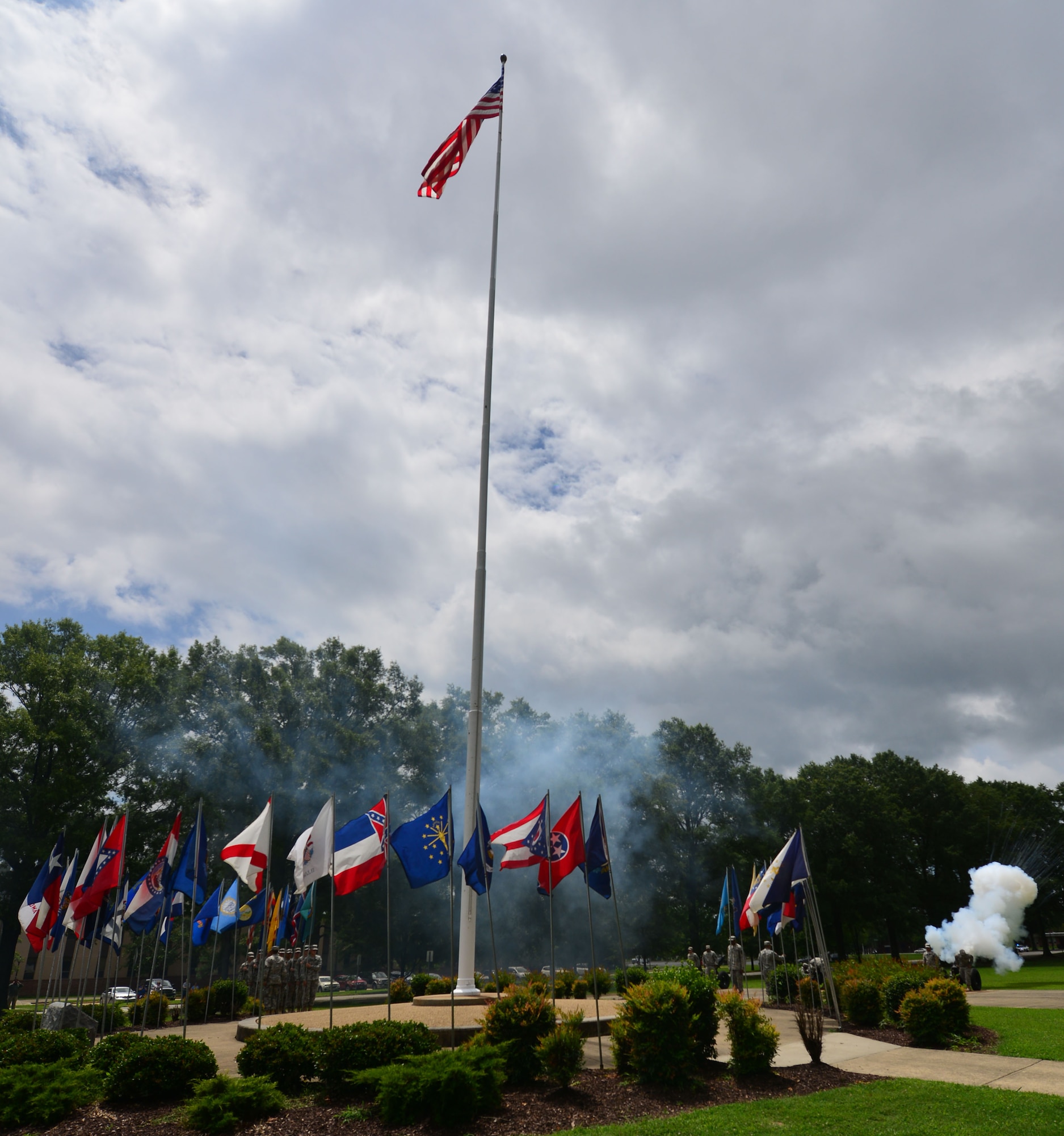 Cannons fire during the Salute to the Nation Ceremony at Seay Plaza on Fort Eustis, Va., July 4, 2015. As the cannons fired 50 rounds, one for each state, U.S. Army Soldiers carried state flags to the center of the plaza in celebration on Independence day. (U.S. Air Force photo by Staff Sgt. Natasha Stannard/Released)