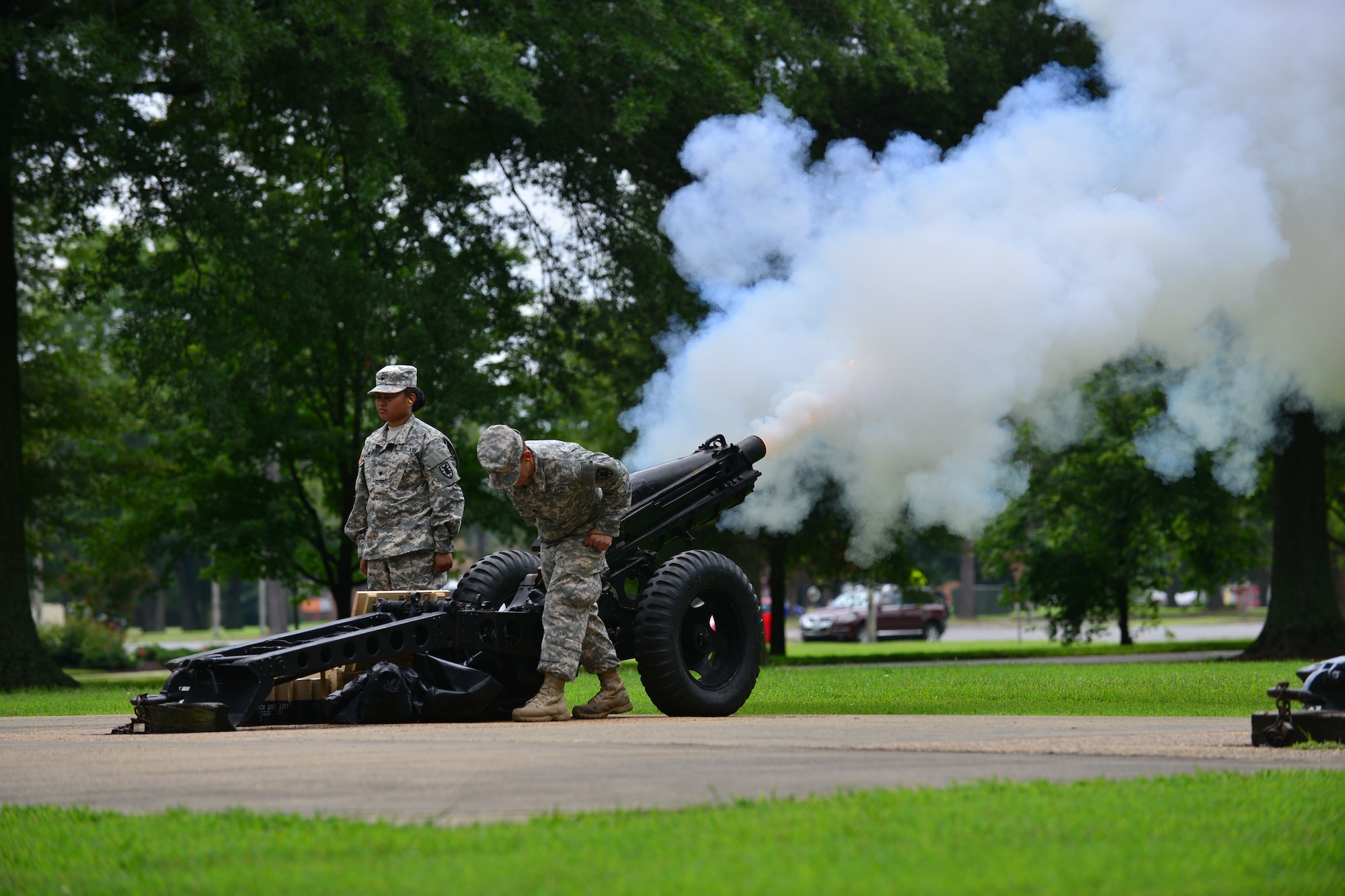 U.S. Army Soldiers from the 7th Transportation Brigade (Expeditionary) Salute Battery fire cannon rounds during the Salute to the Nation Ceremony at Seay Plaza on Fort Eustis, Va., July 4, 2015. The ceremony honored each state’s entry into the union with cannon fire. (U.S. Air Force photo by Staff Sgt. Natasha Stannard/Released)