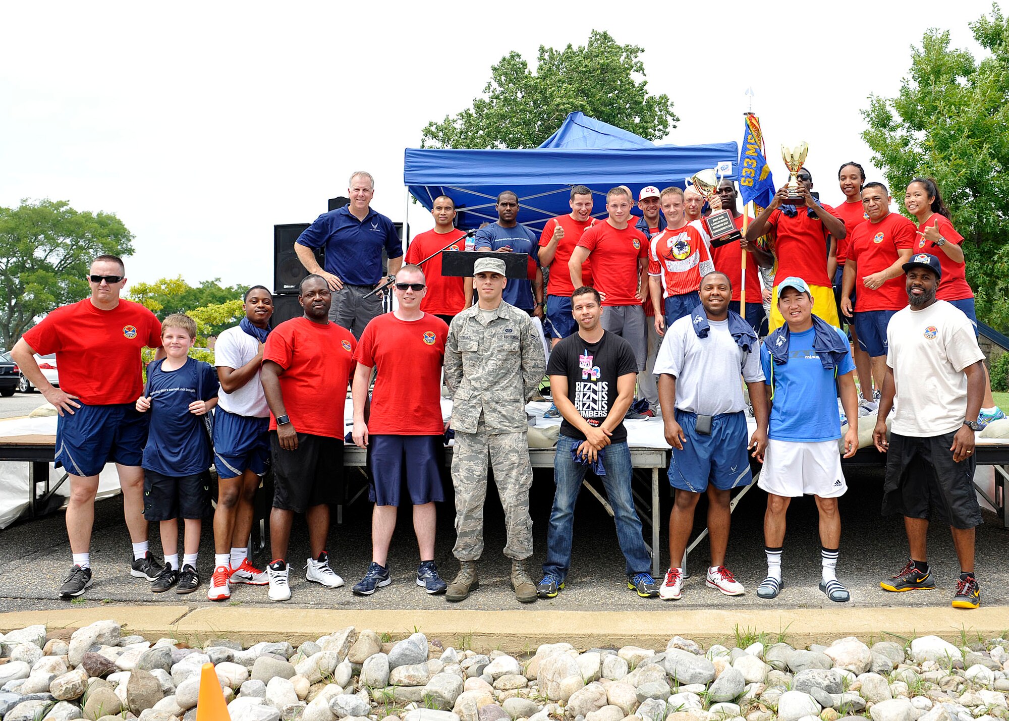 633rd Civil Engineer Squadron members pose for a photo during Warrior Day at Langley Air Force Base, Va., July 2, 2015. The 633rd CES won the Commander’s Cup for the most participants, volunteers and wins of the day’s events. (U.S. Air Force photo by Senior Airman Breonna Veal/Released)