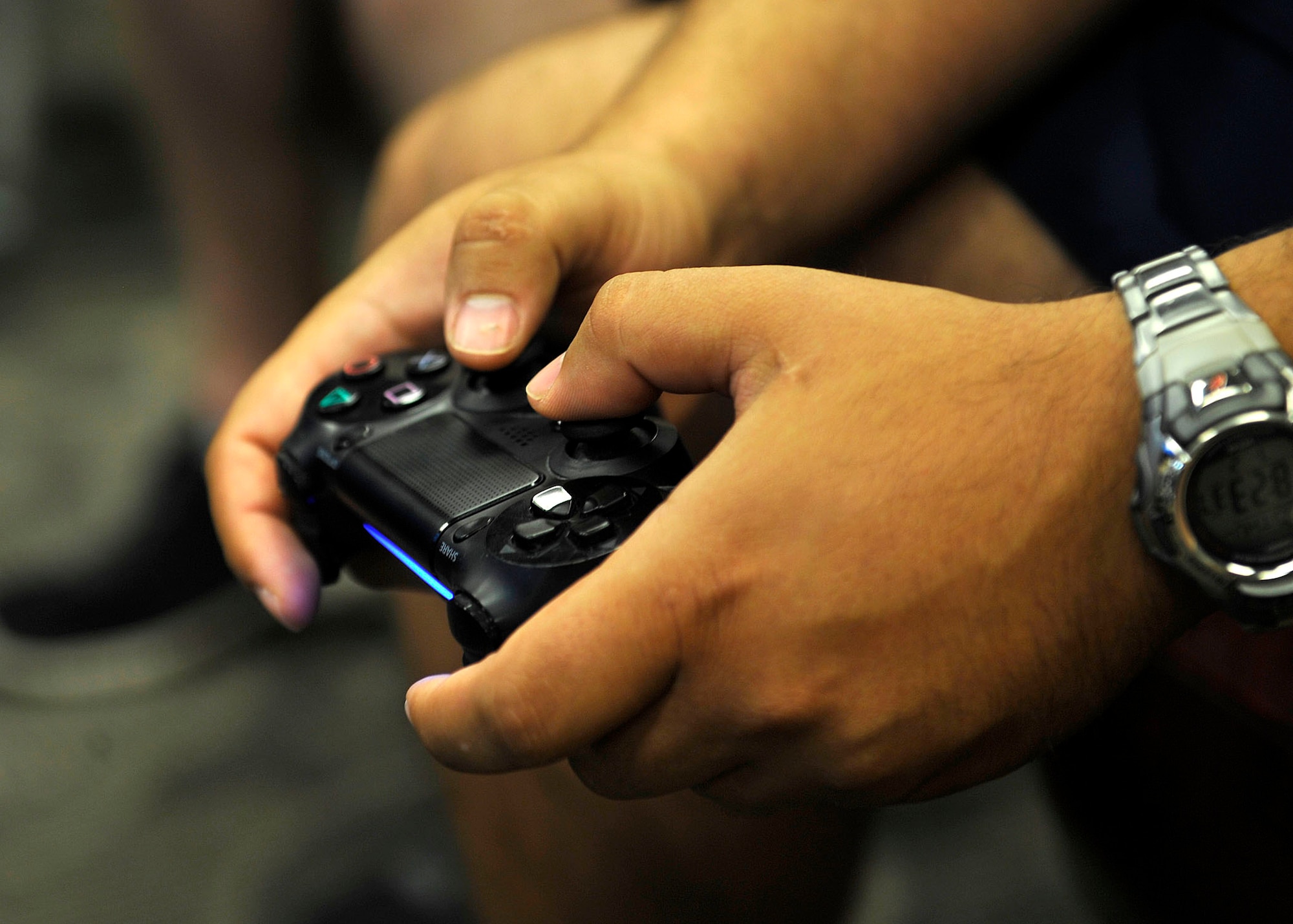 A U.S. Service member plays video games during a tournament during Warrior Day at Langley Air Force Base, Va., July 2, 2015. Other events during Warrior Day included basketball, softball, soccer and more. (U.S. Air Force photo by Senior Airman Breonna Veal/Released)