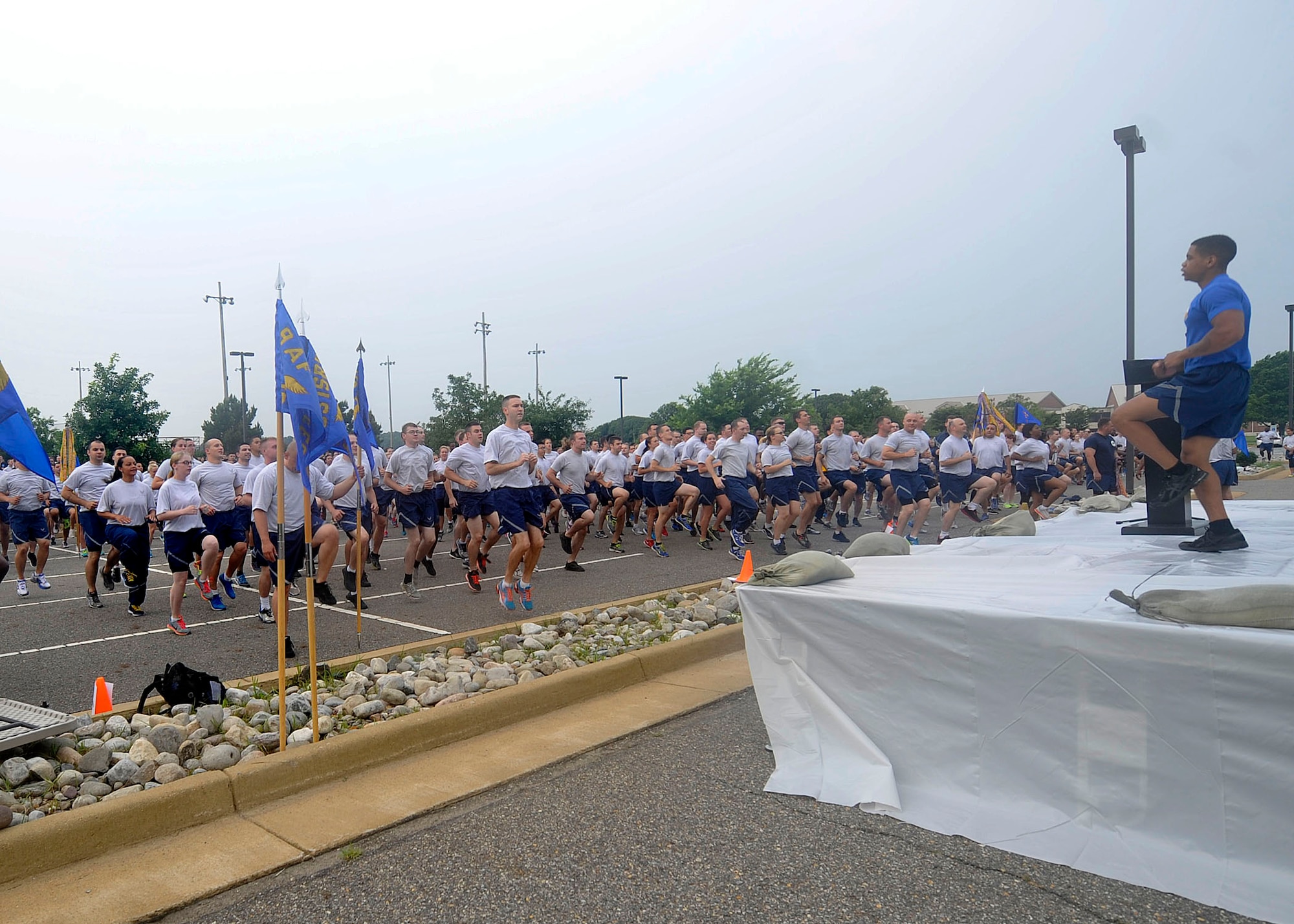 U.S. Air Force Airmen warm-up before the Warrior Day formation run at Langley Air Force Base, Va., July 2, 2015. The 2-mile formation run kicked-off the day’s events that included various sports events and an awards presentation ceremony to end the day. (U.S. Air Force photo by Senior Airman Breonna Veal/Released)