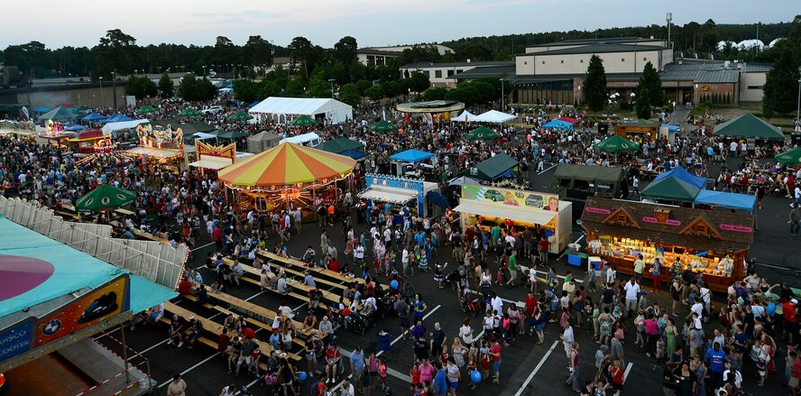 Patrons of this year’s Freedom Fest partake in rides, games and food July 4, 2015, at Ramstein Air Base, Germany. The fair was a two-day event held in celebration of the United States’ Independence Day. It also featured live music and a fireworks show. (U.S. Air Force photo/Airman 1st Class Tryphena Mayhugh)