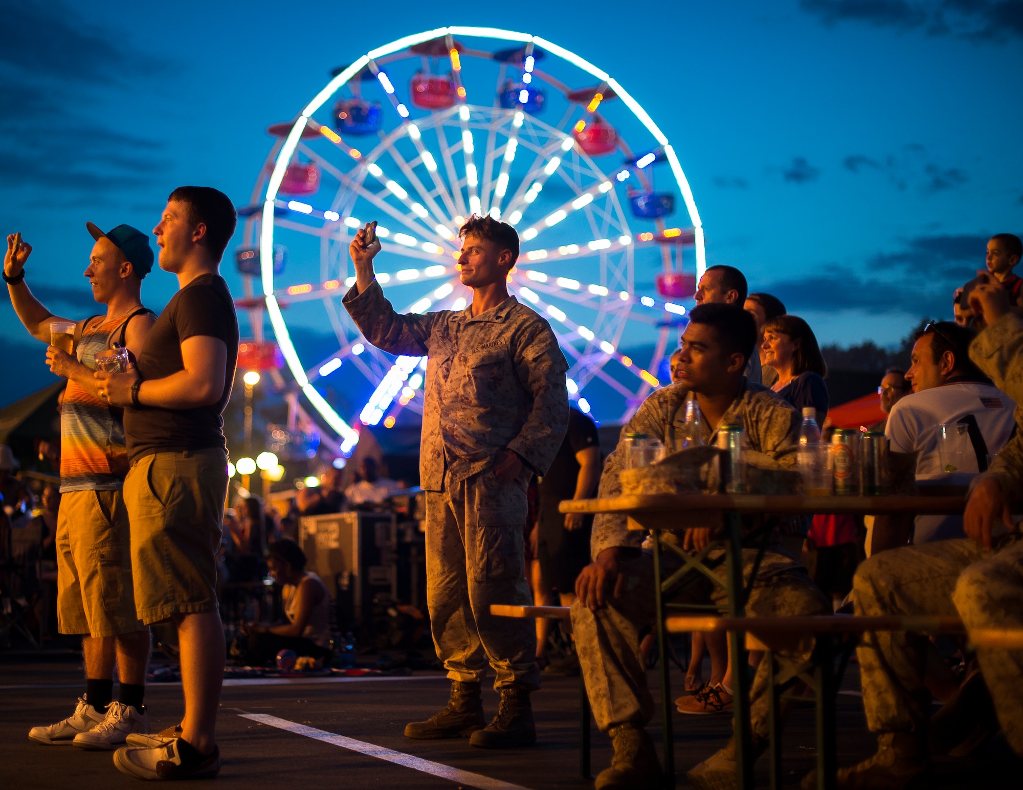 Attendees enjoy a concert during the Freedom Fest, July 4, 2015, at Ramstein Air Base, Germany. The festival was held in celebration of the United States’ Independence Day. Being stationed thousands of miles away from the U.S., service members and their families were able to enjoy a small part of home with barbeque food, fireworks and American music. (U.S. Air Force photo/Senior Airman Damon Kasberg)