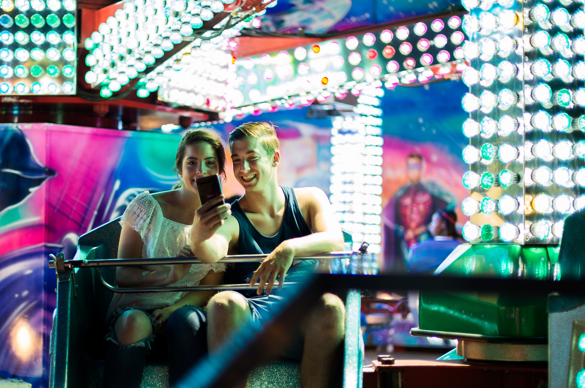 Attendees of this year’s Freedom Fest pose for a photograph while on an amusement ride July 4, 2015, at Ramstein Air Base, Germany. The two-day event was held in celebration of the United States’ Independence Day. Attendees were able to enjoy rides, food, fireworks and live music. (U.S. Air Force photo/Senior Airman Damon Kasberg)
