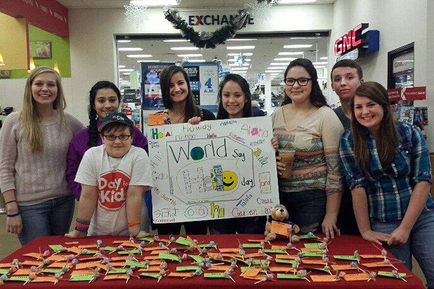 Members of the Youth Center Teen Council here pose for a photo outside the Hanscom Main Exchange during a "Hello Day" event in December 2014. The teens handed out lollipops with "hello" tags attached as part of a random act of kindness to strangers event. The Youth Center’s Teen Council recently learned from the Boys and Girls Clubs of America that they were selected as a Keystone Legacy Level. (Courtesy photo)