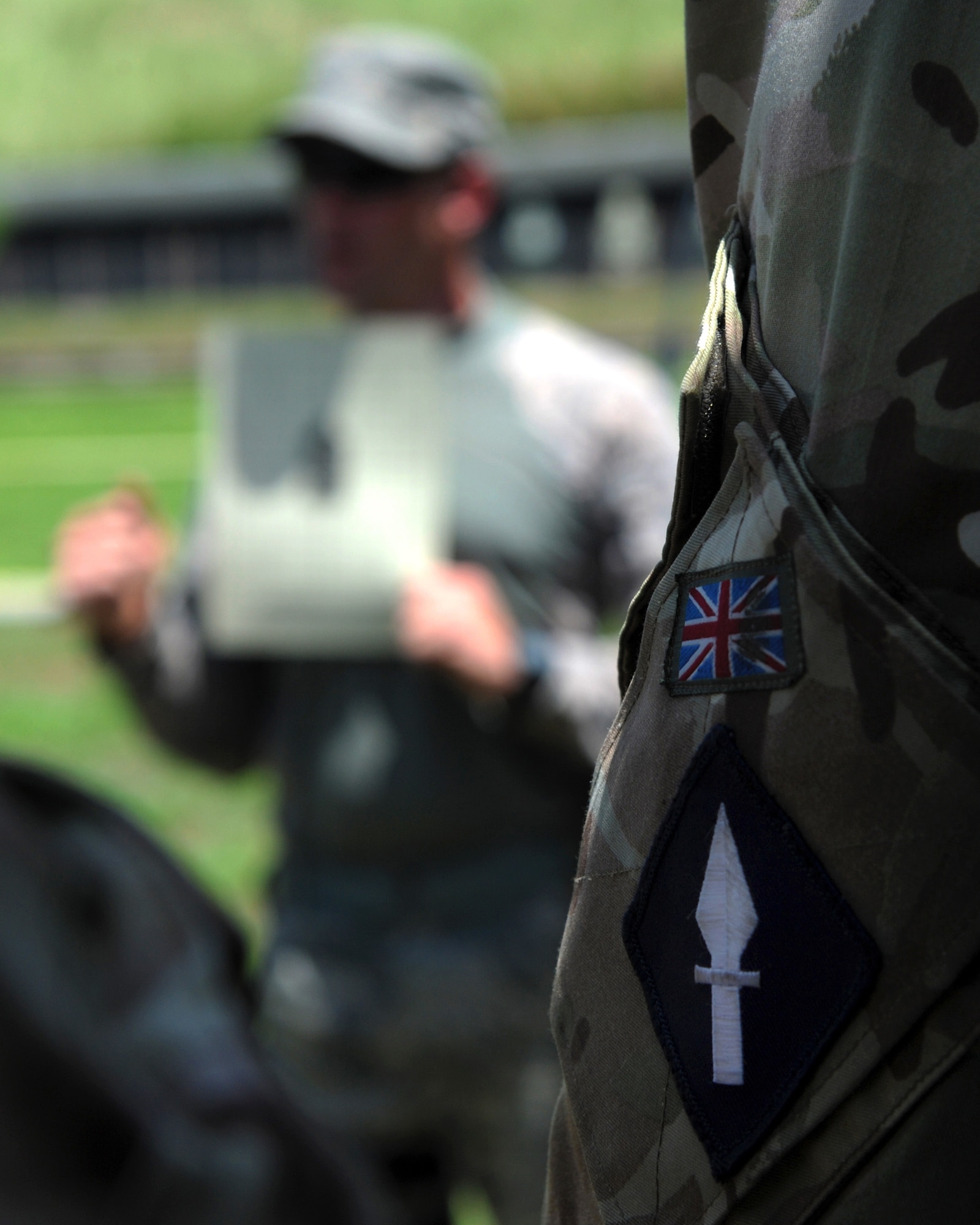 The British army 258th Signal Squadron members join the Joint Communications Support Element June 25, 2015, at the Hillsborough County Sheriff’s Office Outdoor Shooting Range in Lithia, Fla. The day tested the participants’ strength and endurance through an obstacle course and rifle range. (U.S. Air Force photo by Airman 1st Class Danielle Conde/Released)
