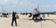 A U.S. Air Force Airman from the 480th Aircraft Maintenance Unit, 52nd Aircraft Maintenance Squadron Spandahlem Air Base, Germany marshals his F-16C Fighting Falcon at Pease Air National Guard Base, N.H., on July 6, 2015.  A contingent of the Spangdahlem-based aircraft landed at Pease while in transit to a training exercise in the United States. The 52 FW supports the supreme allied commander Europe with mission-ready personnel and systems providing expeditionary air power for suppression of enemy air defenses, close air support, air interdiction, counter air, air strike control, strategic attack, combat search and rescue, and theater airspace control. The wing also supports contingencies and operations other than war as required (U.S. Air National Guard photo by Staff Sgt. Curtis J. Lenz/RELEASED)