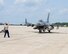 A U.S. Air Force Airman from the 480th Aircraft Maintenance Unit, 52nd Aircraft Maintenance Squadron Spandahlem Air Base, Germany marshals his F-16C Fighting Falcon at Pease Air National Guard Base, N.H., on July 6, 2015.  A contingent of the Spangdahlem-based aircraft landed at Pease while in transit to a training exercise in the United States. The 52 FW supports the supreme allied commander Europe with mission-ready personnel and systems providing expeditionary air power for suppression of enemy air defenses, close air support, air interdiction, counter air, air strike control, strategic attack, combat search and rescue, and theater airspace control. The wing also supports contingencies and operations other than war as required (U.S. Air National Guard photo by Staff Sgt. Curtis J. Lenz/RELEASED)