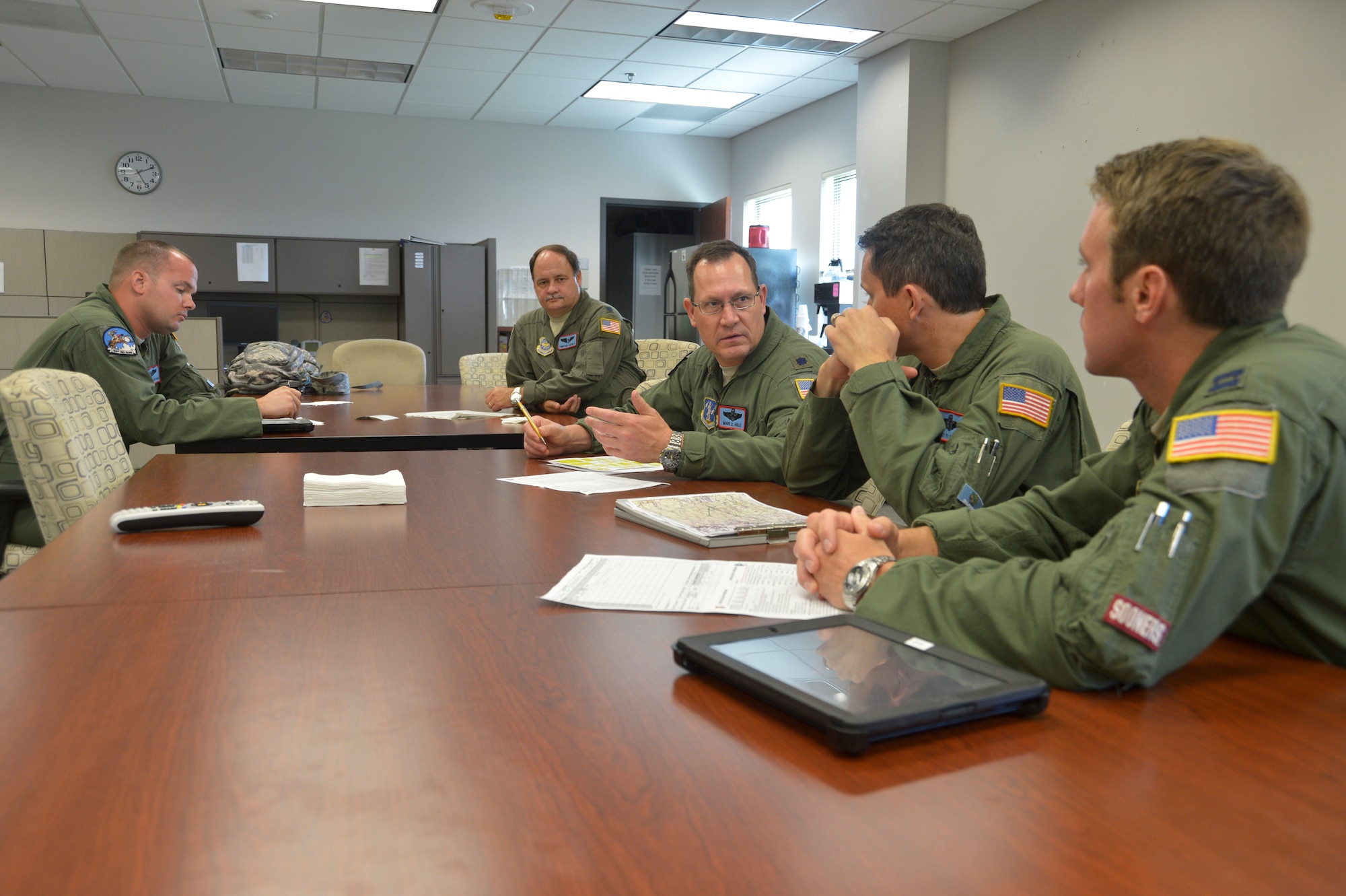 U.S. Air Force Lt. Col. Mark Hole, tanker detachment commander, assigned to the 185th Air Refueling Squadron, briefs the aircrew before flying the last training mission of the 185 ARS on Tinker Air Force base, June 30, 2015, at Tinker Air Force base, Okla.  The 185 ARS will be transitioning to Air Force Special Operations Command. (U.S. Air National Guard photo by Tech Sgt. Caroline Essex/Released)