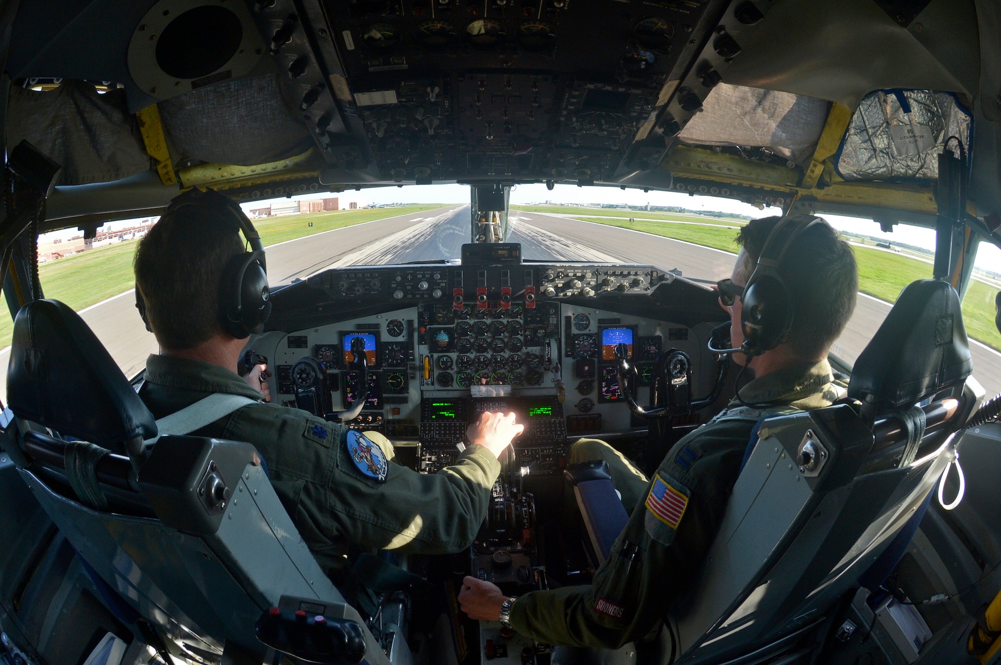 U.S. Air Force Lt. Col. Mark Hole, pilot, and Captain Thomas Bryceland, co-pilot, 185th Air Refueling Squadron, prepare for takeoff in the KC-135 Stratotanker for the last time during the last training mission of the 185 ARS on Tinker Air Force base, June 30, 2015 at Tinker Air Force base, Okla. The 185 ARS will be transitioning to Air Force Special Operations Command. (U.S. Air Force photo by Tech Sgt. Caroline Essex/Released)
