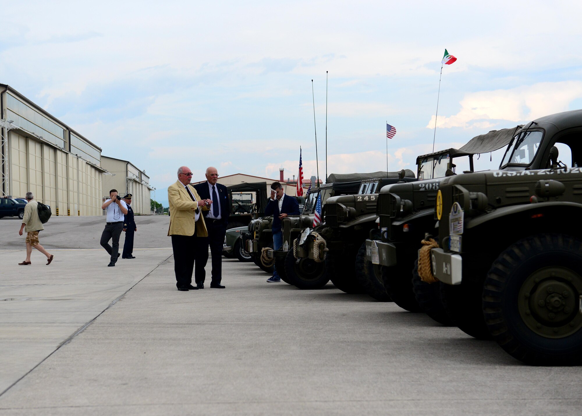 Attendees of the 60th Anniversary celebration view static displays of vintage vehicles, July 3, 2015, at Aviano Air Base, Italy. The celebration was held to honor 60 years of partnership between Italy and the U.S. (U.S. Air Force photo by Airman 1st Class Deana Heitzman/Released)