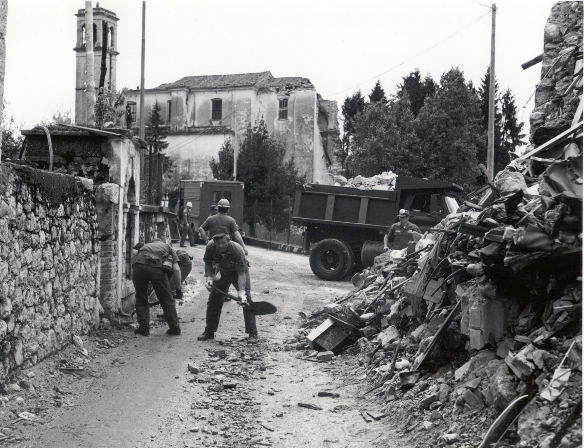 Members of the 40th Tactical Group clear rubble from the roads in 1976 in Forgaria, Italy. In all, Air Force engineers and Italian personnel cleared debris from 15 miles of road. (Courtesy photo)