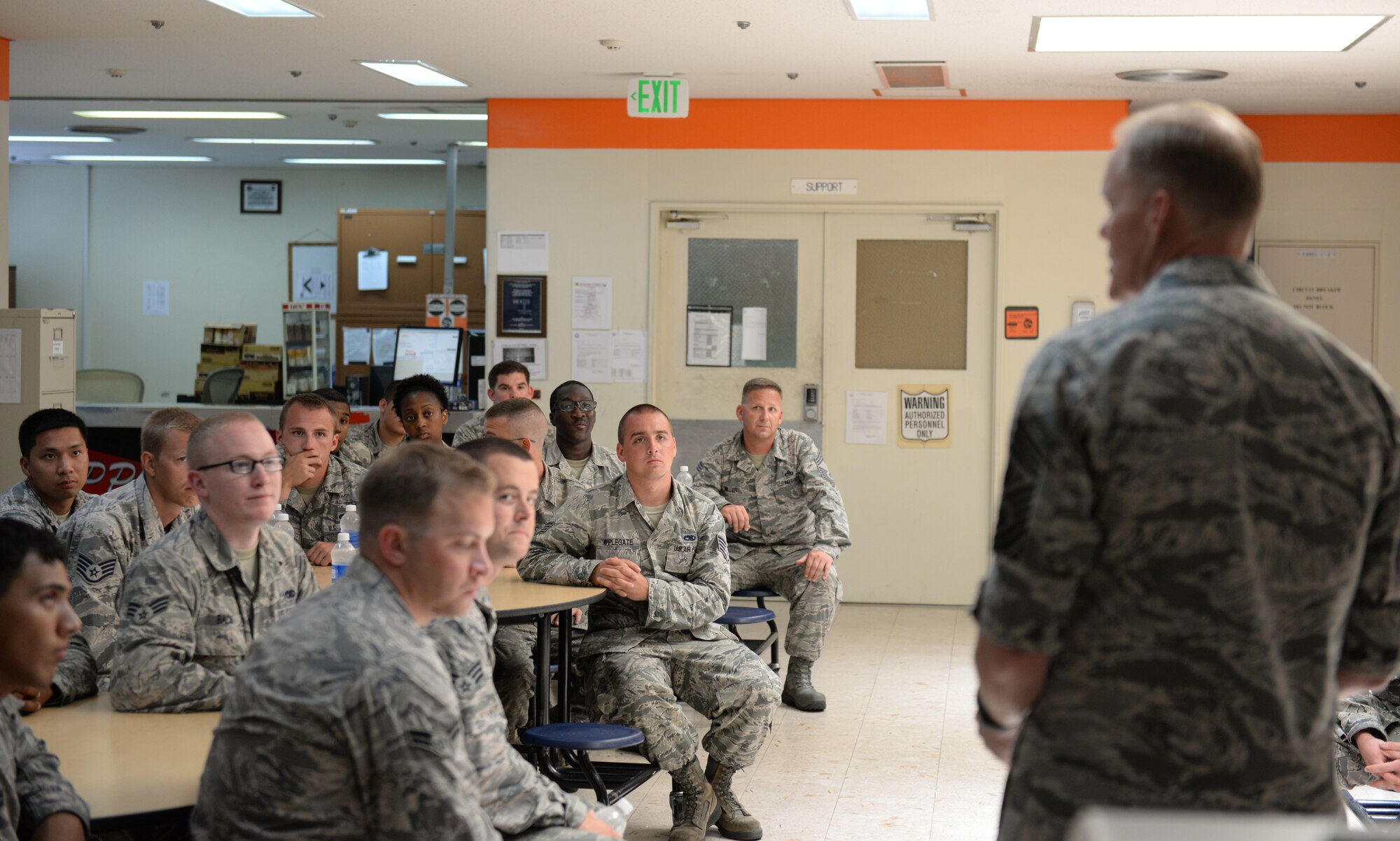 Chief Master Sgt. of the Air Force James Cody answers questions about the future of the Air Force for Airmen of the 718th Aircraft Maintenance Squadron on Kadena Air Base, Japan, July 8, 2015. While on Kadena, Cody spoke face-to-face with enlisted personnel that made up Team Kadena. (U.S. Air Force photo by Senior Airman Omari Bernard)