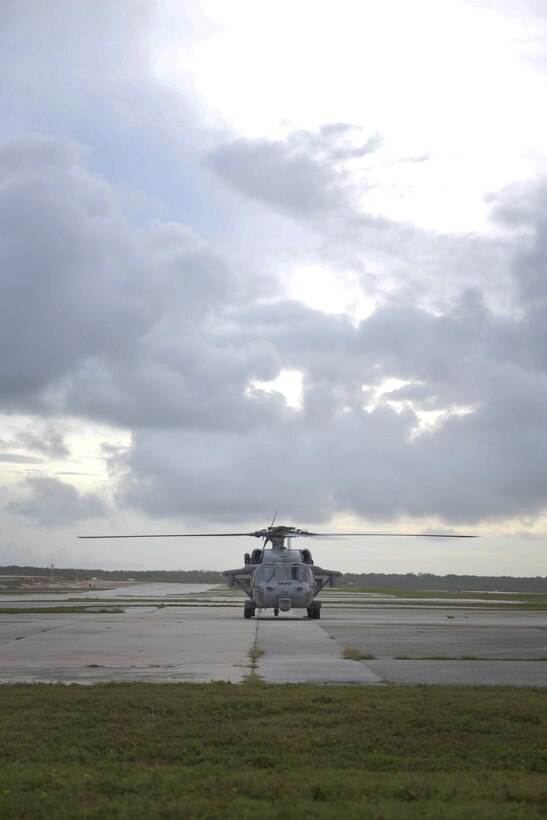 A MH-60 Sierra, assigned to Helicopter Sea Combat Squadron 25, prepares for take-off July 3, 2015, at Andersen Air Force Base, Guam. HSC-25 provides vital airlift support to the 736th Security Forces Squadron, assisting with their quarterly static line parachute operations. (U.S. Air Force photo by Senior Airman Katrina M. Brisbin/Released)