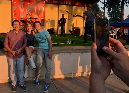 Airmen from Team Incirlik pose for a photo with Alaina Blair, American singer and Armed Forces Entertainment performer, during a 4th of July Festival July 4, 2015, at Incirlik Air Base, Turkey. Blair is a country/pop singer who recently appeared as a contestant on season seven of “The Voice.” (U.S. Air Force photo by Senior Airman Michael Battles/Released)