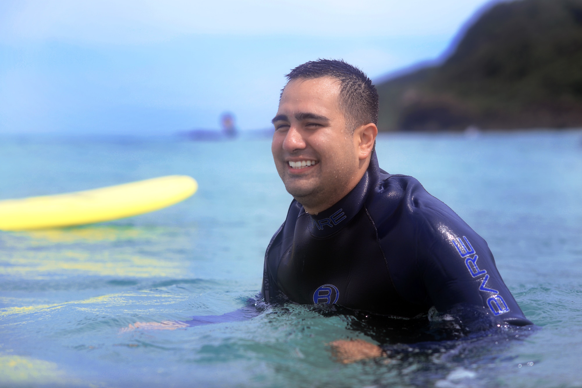 An Airman from Yokota swims in the waters of Tadato Beach in Shimoda, Japan, June 27, 2015. As part of the surf retreat, Airmen also discussed and learned the differences between men and women to foster better communication. (U.S. Air Force photo by Airman 1st Class Delano Scott/Released)