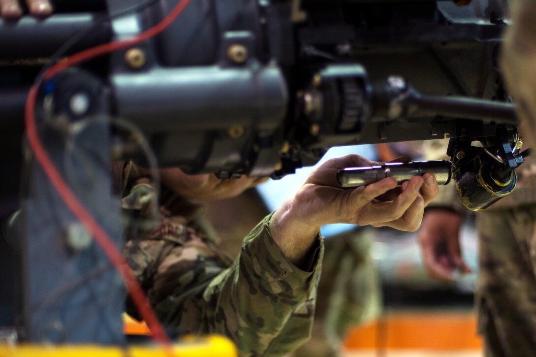 U.S. Air Force Staff Sgt. Max Kirschner inspects an F-16 Fighting Falcon 20mm Gatling gun on Bagram Airfield, Afghanistan, July 5, 2015. Kirschner is assigned to the 455th Expeditionary Maintenance Squadron Armament Flight.