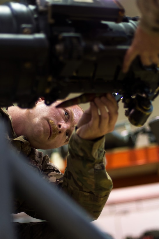 U.S. Air Force Staff Sgt. Max Kirschner performs an inspection on an F-16 Fighting Falcon 20mm Gatling gun on Bagram Airfield, Afghanistan, July 5, 2015. Kirschner is assigned to the 455th Expeditionary Maintenance Squadron Armament Flight.