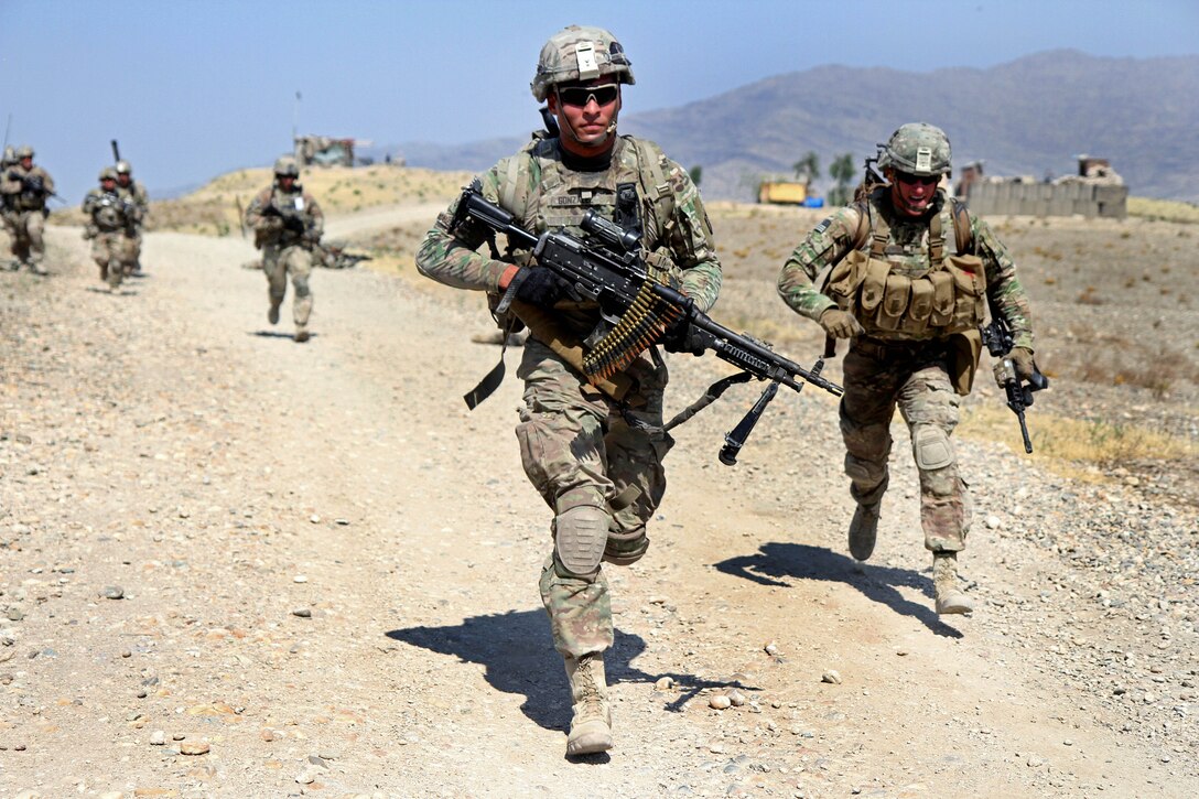 U.S. Army Pfc. Gonzalez, foreground, and fellow soldiers sprint toward an objective during a live-fire exercise on Tactical Base Gamberi, Afghanistan, July 3, 2015. Gonzalez is assigned to the 101st Airborne Division's 3rd Brigade Combat Team.